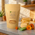 Aloe Vera & Calendula - Fugly Soap bar stack with aloe vera leaf and calendula flowers on a countertop next to eco packaging