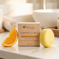 Shampoo & Conditioner Set - Citrus featuring natural shampoo bar with lemongrass and sweet orange scent on marble countertop