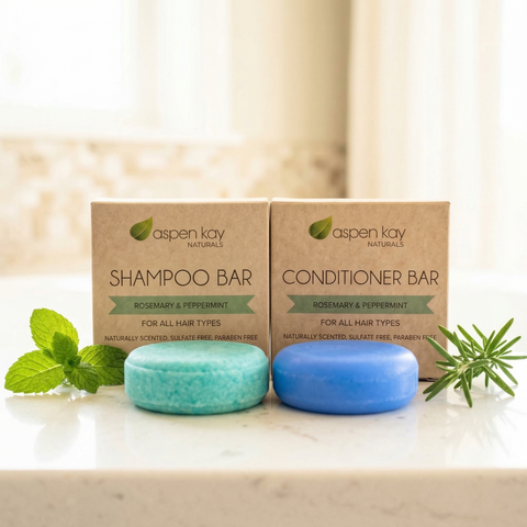 Shampoo & Conditioner Set - Rosemary and Mint with natural blue and green bars alongside fresh rosemary and mint leaves